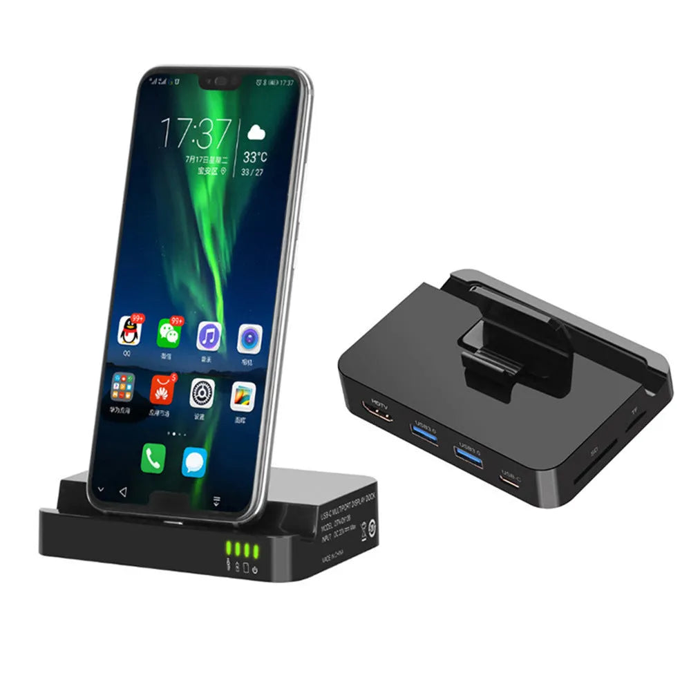 Black aluminium mobile phone dock converter for USB-C to HDMI connection on a desk.