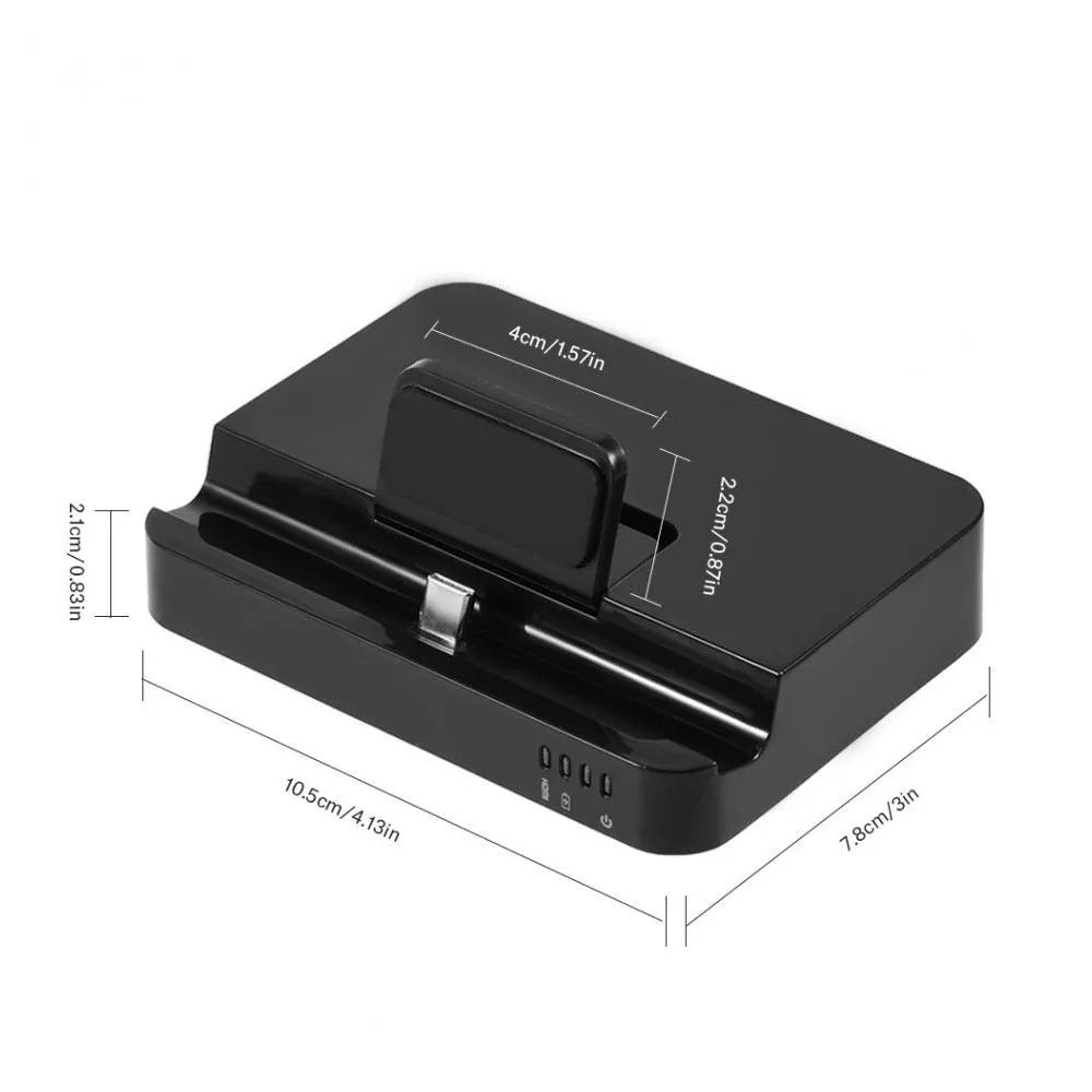 Black aluminium mobile phone dock converter for USB-C to HDMI connection on a desk.