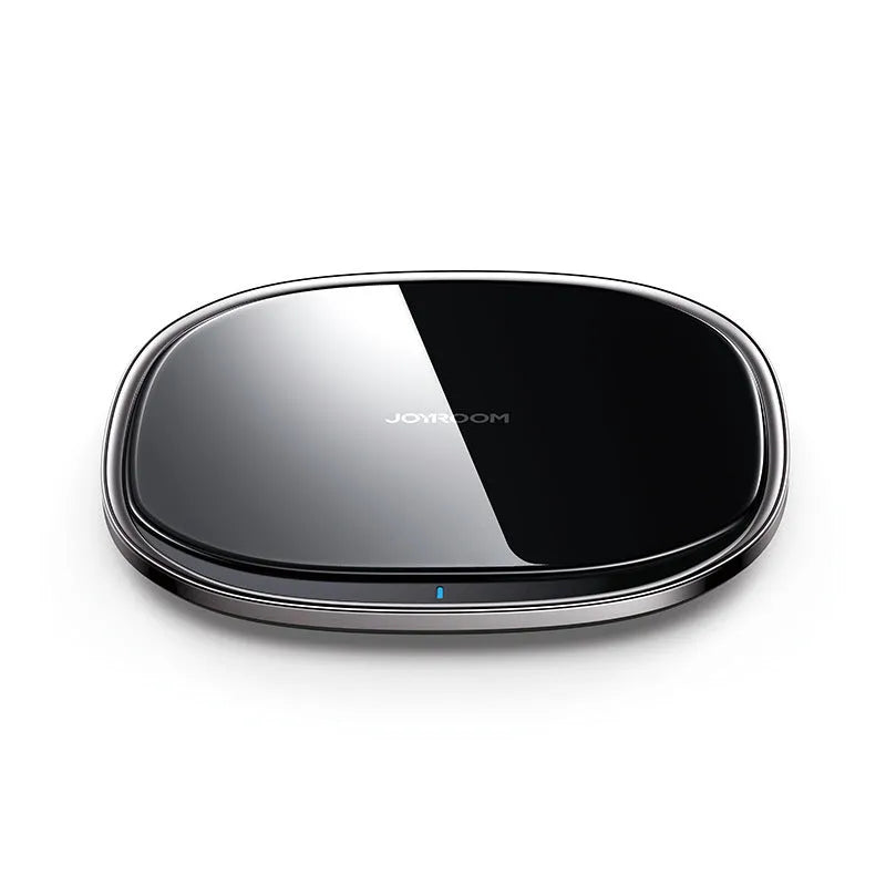 Black wireless phone charger with glass surface showing charging indicator light