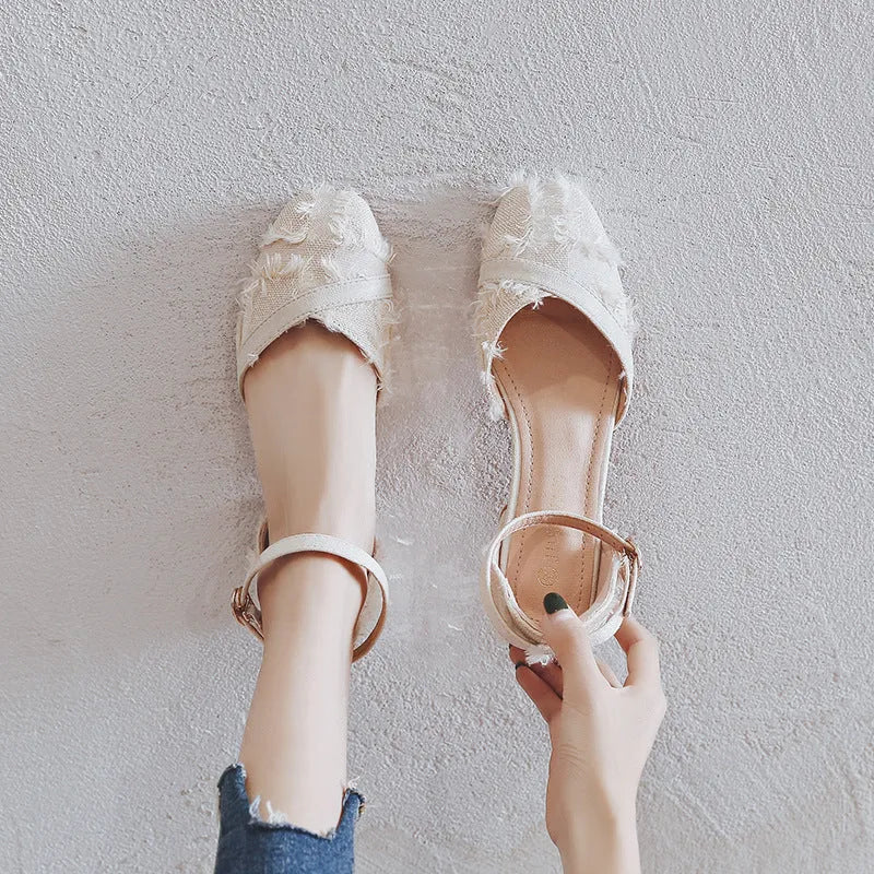 Women's apricot suede D'Orsay flats with an ankle strap and low block heel.