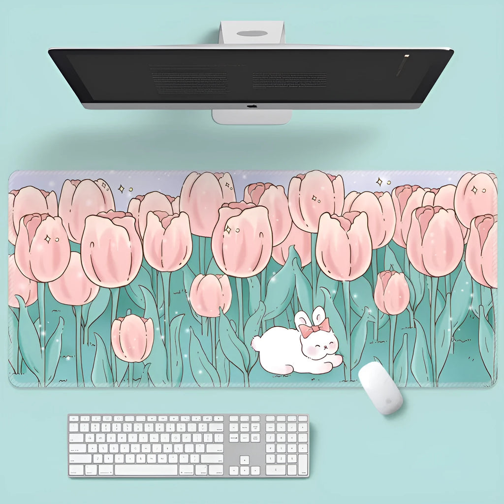 Large flower pattern mouse pad on a desk with keyboard, showing non-slip rubber base and colourful tulip design.