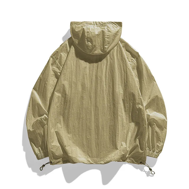 Lightweight Lycra hooded sun protection jacket in gray on a person standing outdoors