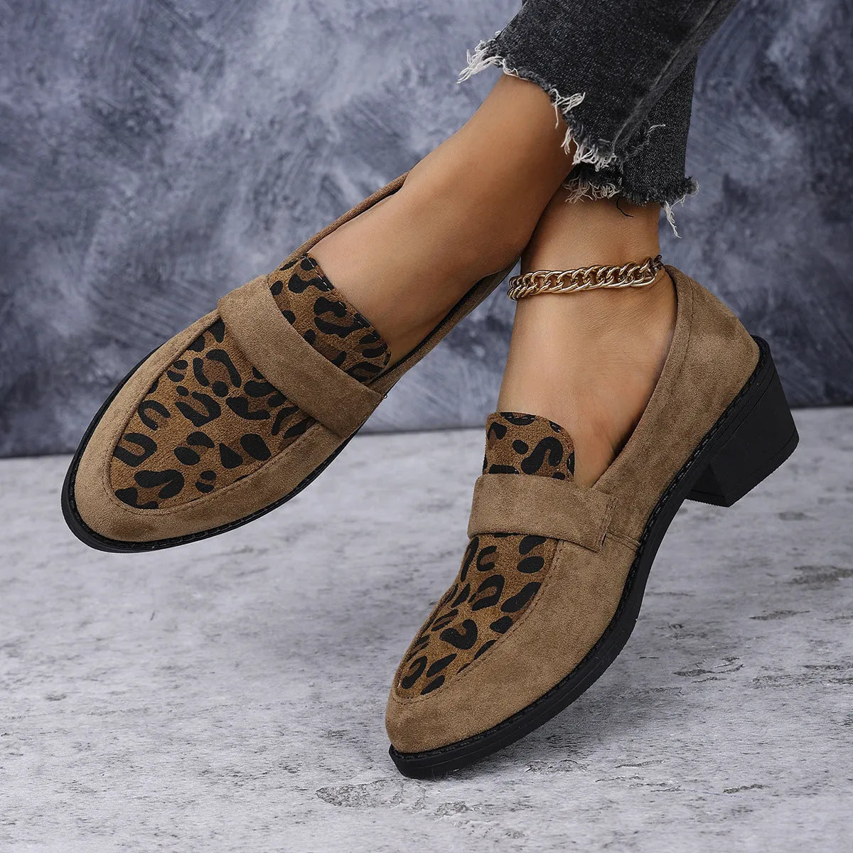 Leopard print slip-on suede shoes with chunky rubber sole and pointed toe design