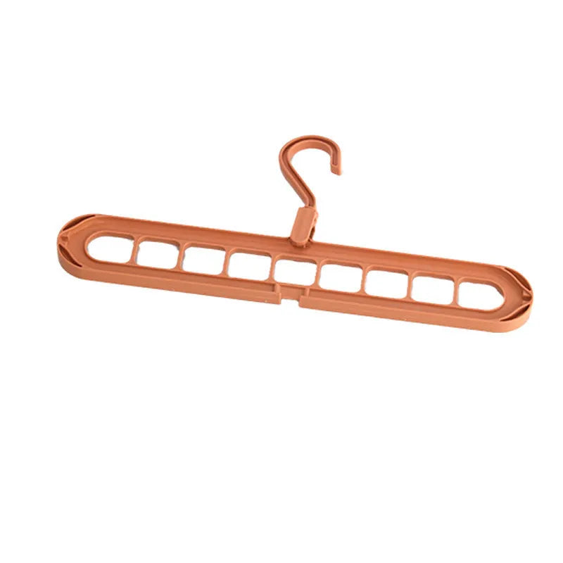 Green plastic nine-hole folding hanger for trousers displayed open and closed.