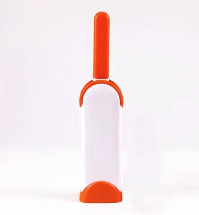 Blue reusable pet hair removal brush with self-cleaning base for sofas and upholstery.