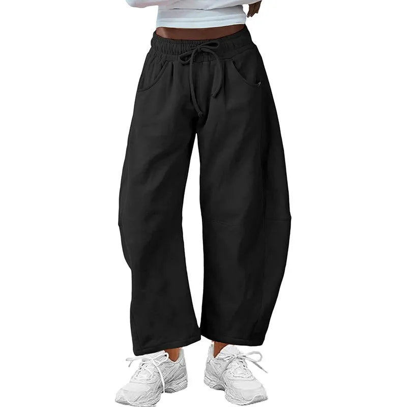 Loose cropped sweatpants with drawstring waist and side pockets in European street style