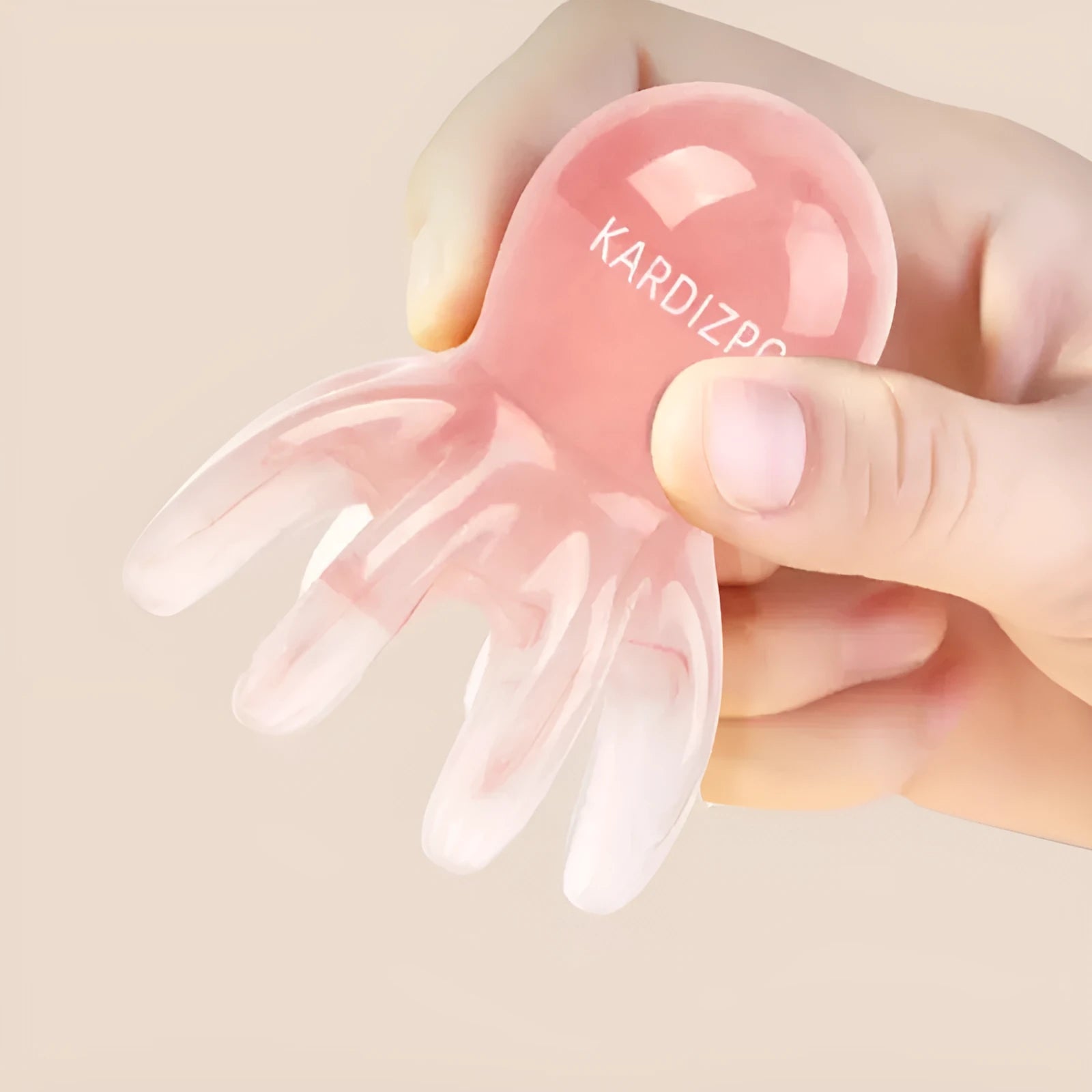 Pink natural resin octopus-shaped massage comb for periocular meridian relief with storage bag.