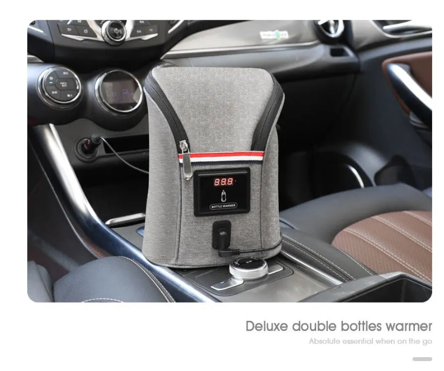 Grey Oxford cloth portable baby bottle warmer bag for car use with 12V charger and temperature display.