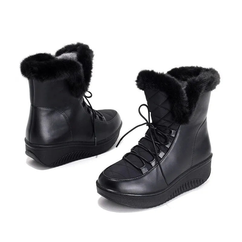 Women's black platform winter boots with lace-up closure and plush lining.