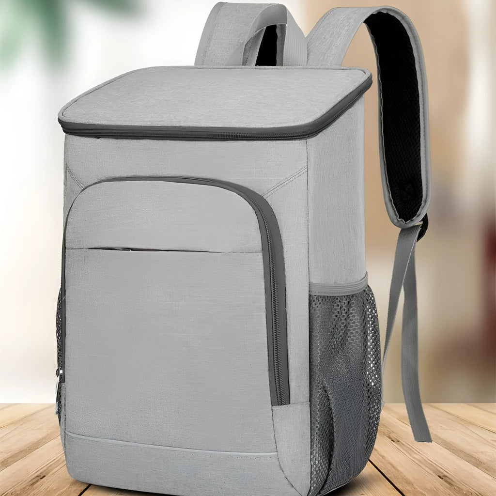 Large black outdoor backpack with curved shoulder straps showing expansion compartments for thermal picnic storage