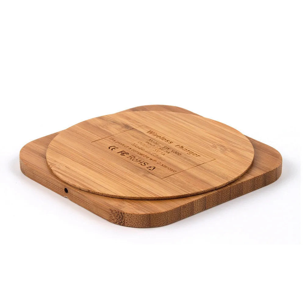 Square bamboo 5W wireless charging pad on a wooden table