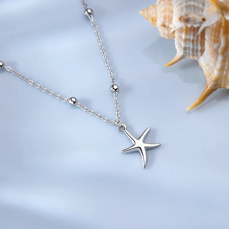 S925 sterling silver anklet with a starfish charm on a round bead chain.