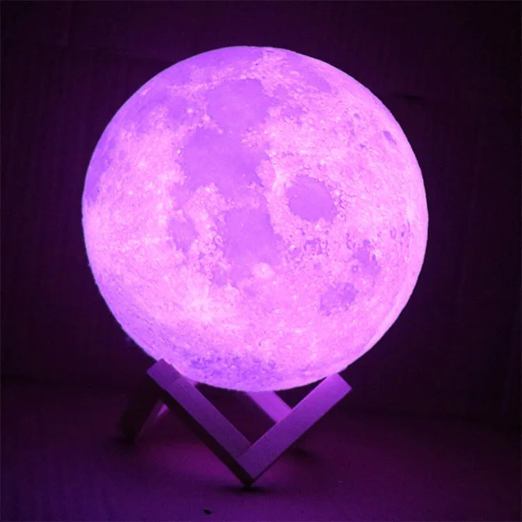 3D printed spherical moon lamp on a wooden stand with touch ring control