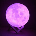3D printed spherical moon lamp on a wooden stand with touch ring control