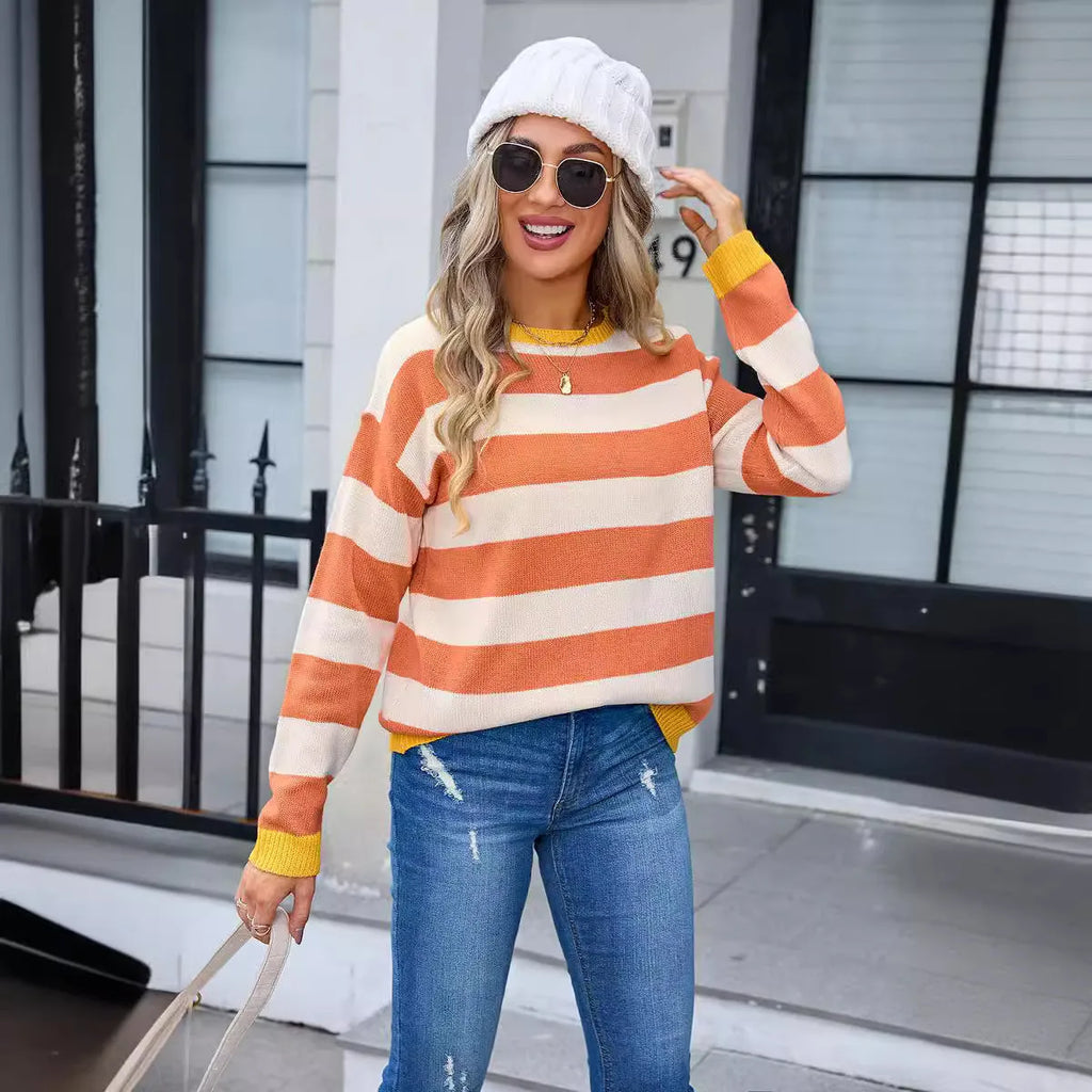 Women's loose blue acrylic long sleeve sweater with round neck on hanger