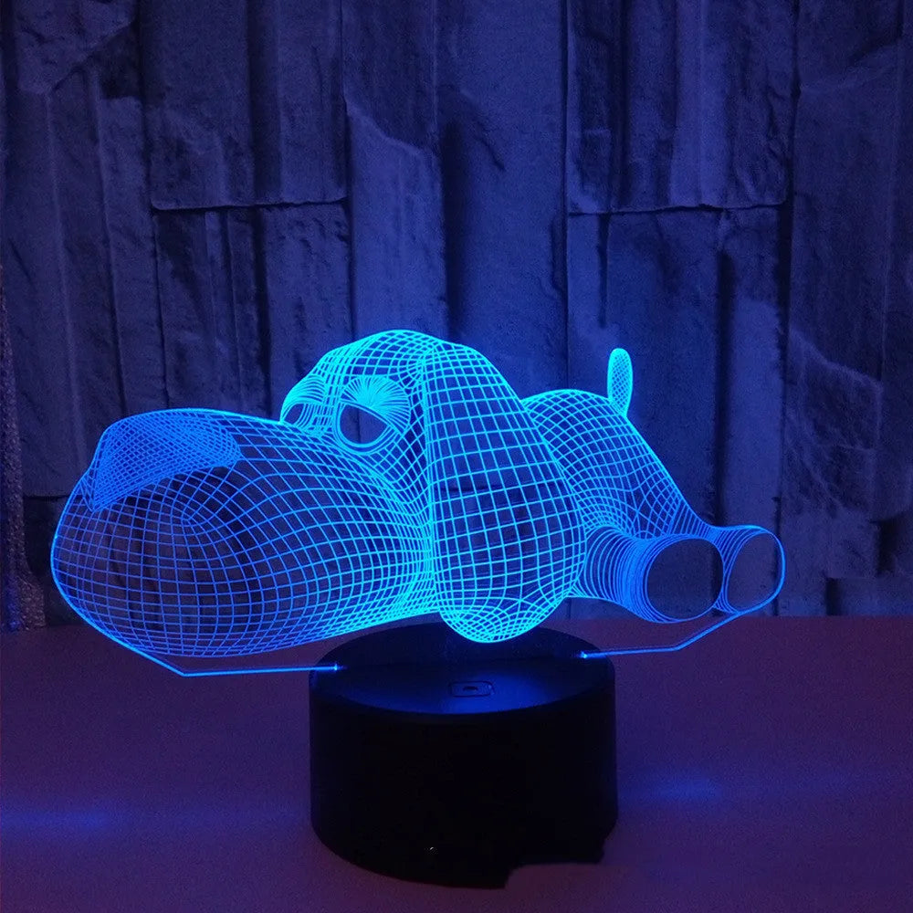 3D illusion dog lamp glowing with multi-colour light on a desk base