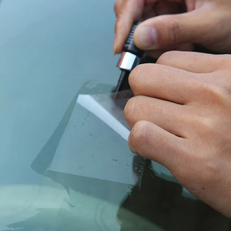 Yellow three-piece car windshield repair tool set for chip and crack repairs