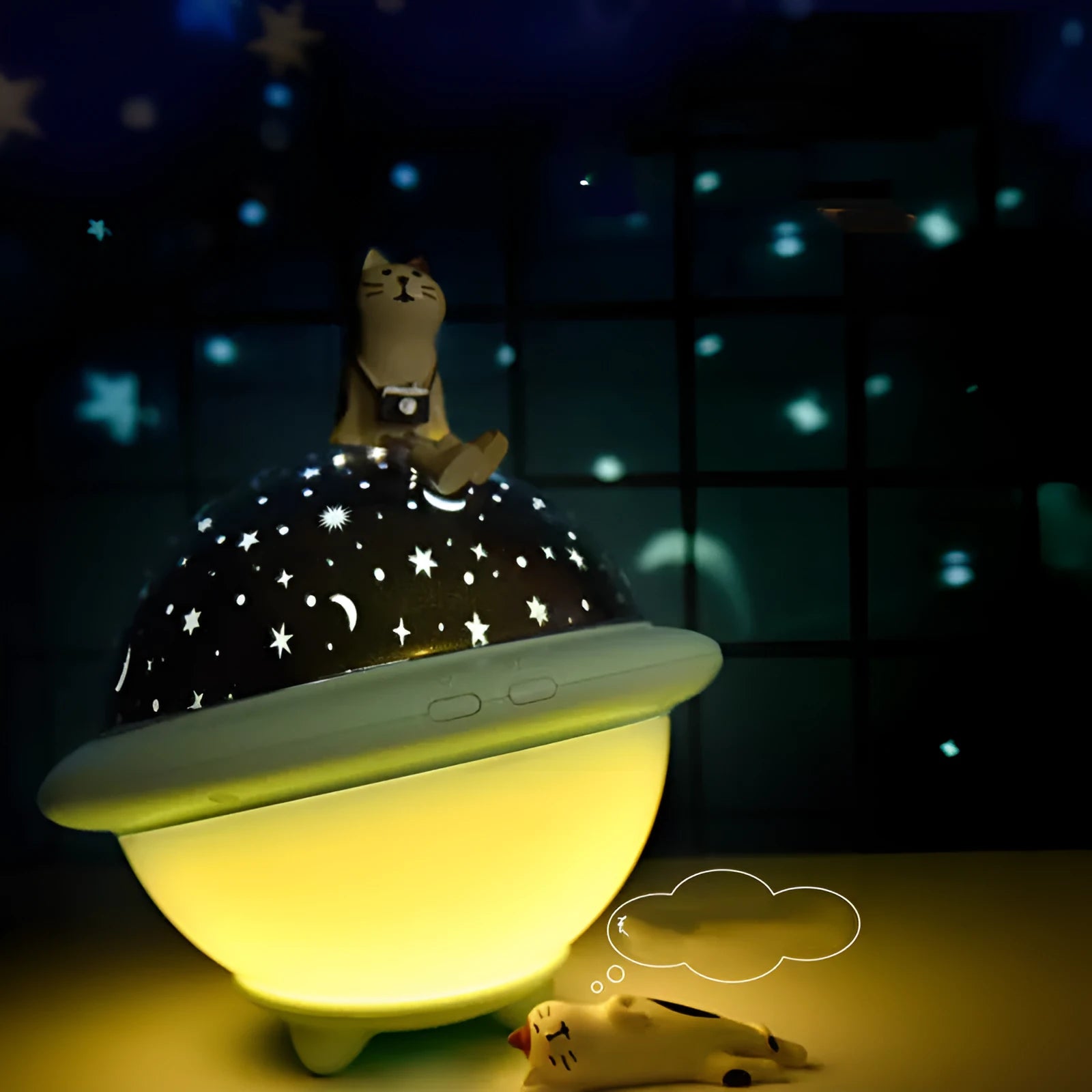 UFO-shaped starry sky projection night light in pink, white or green on a surface