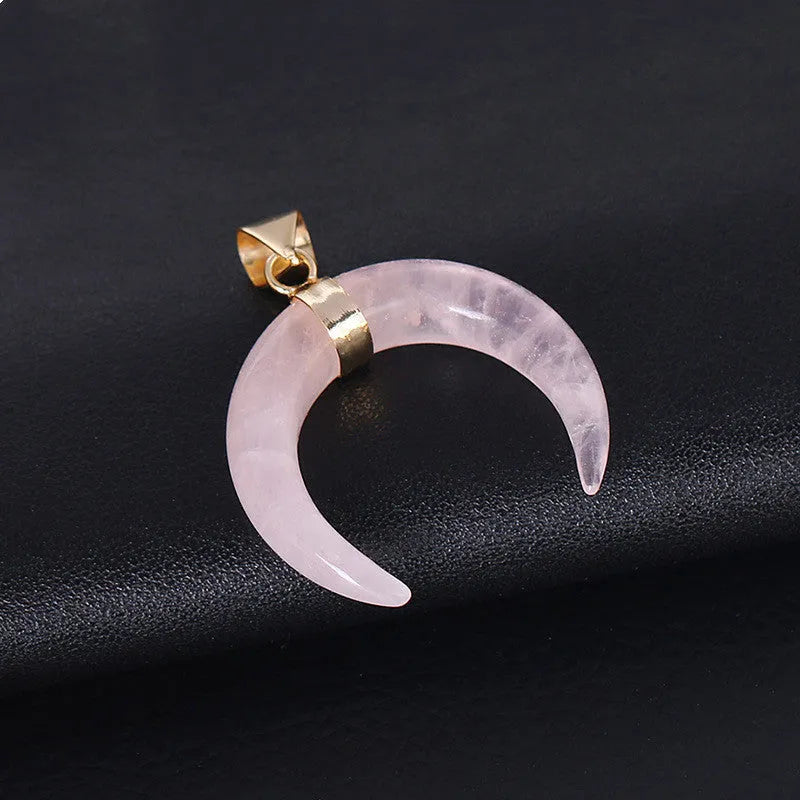 Natural semi-precious stone moon pendant necklace on a 45cm copper chain, shown in pink and purple colour options.