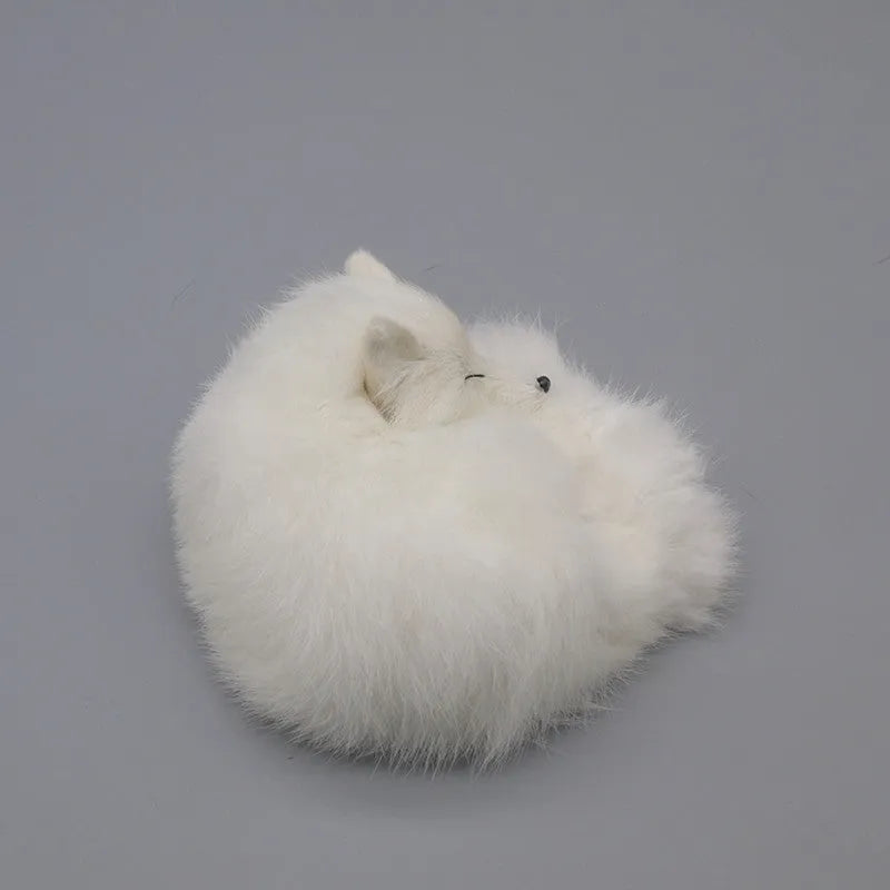 Artificial white fox fur car decoration handicraft on a dashboard.