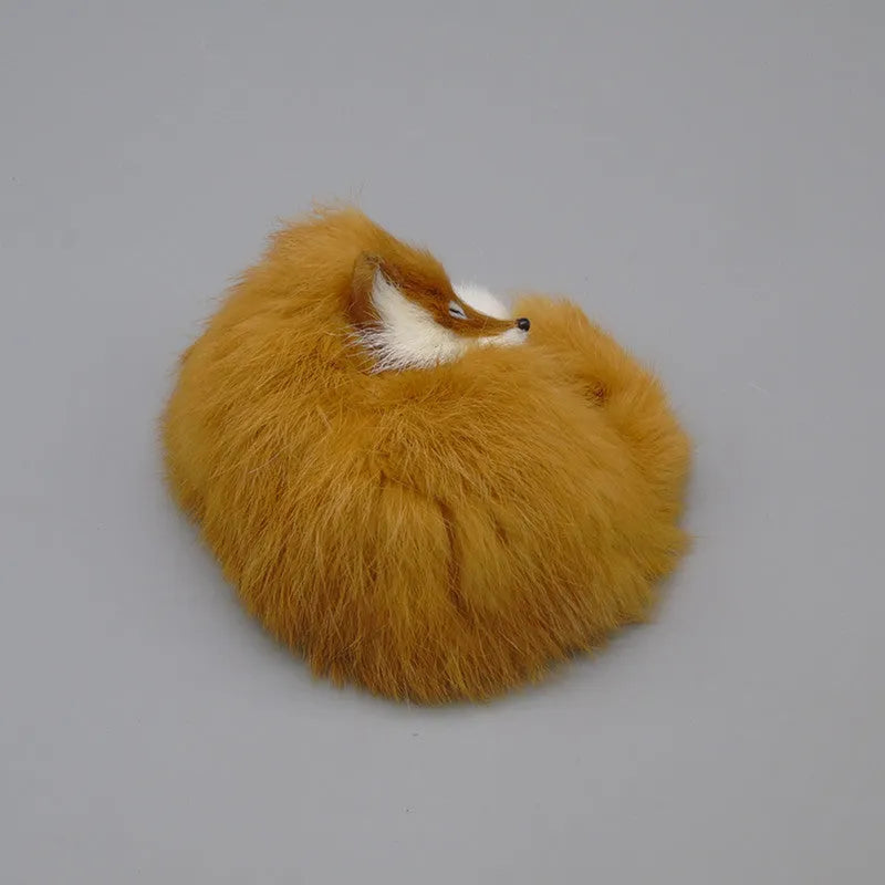 Artificial white fox fur car decoration handicraft on a dashboard.