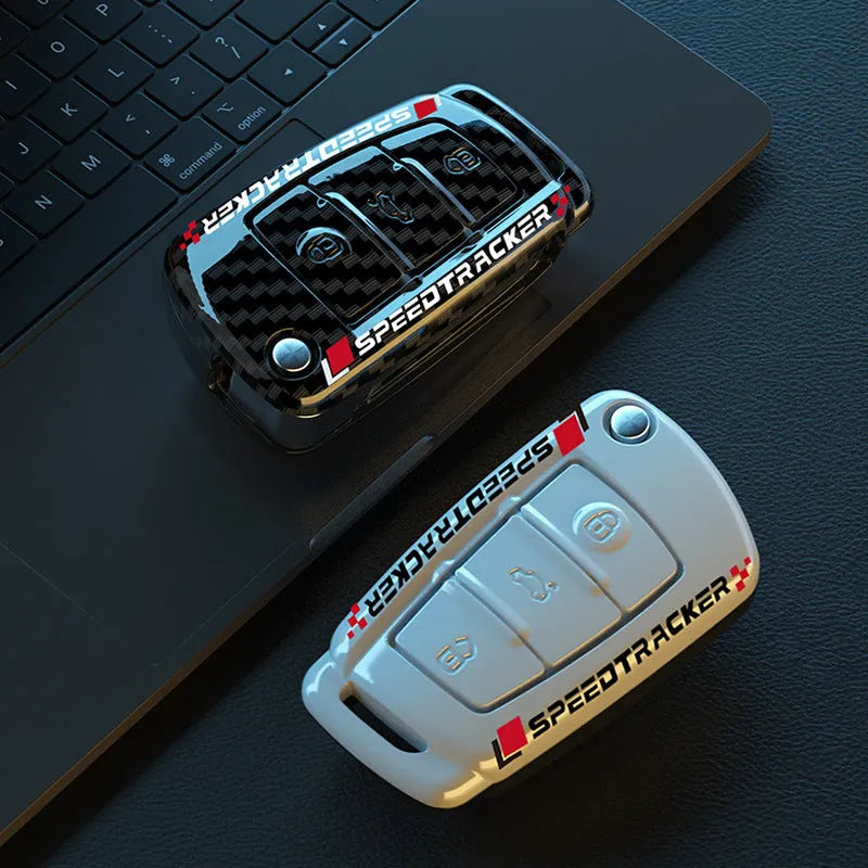 Carbon fibre style car key cover with mirror in feilin material, shown in carbon colour.