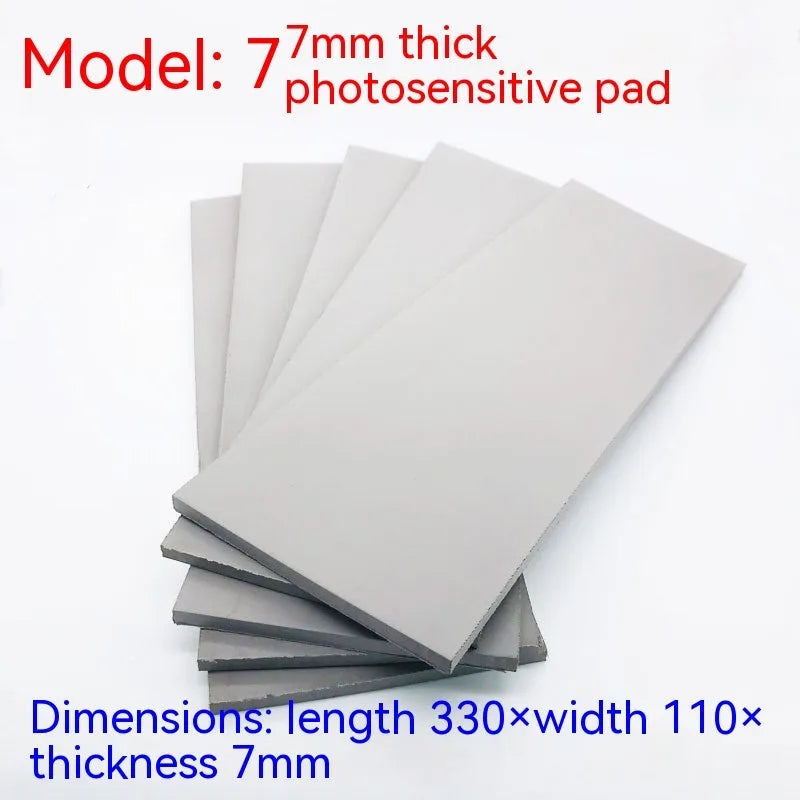 Black and grey plastic light-sensitive mat for photosensitive seals measuring 330mm by 110mm