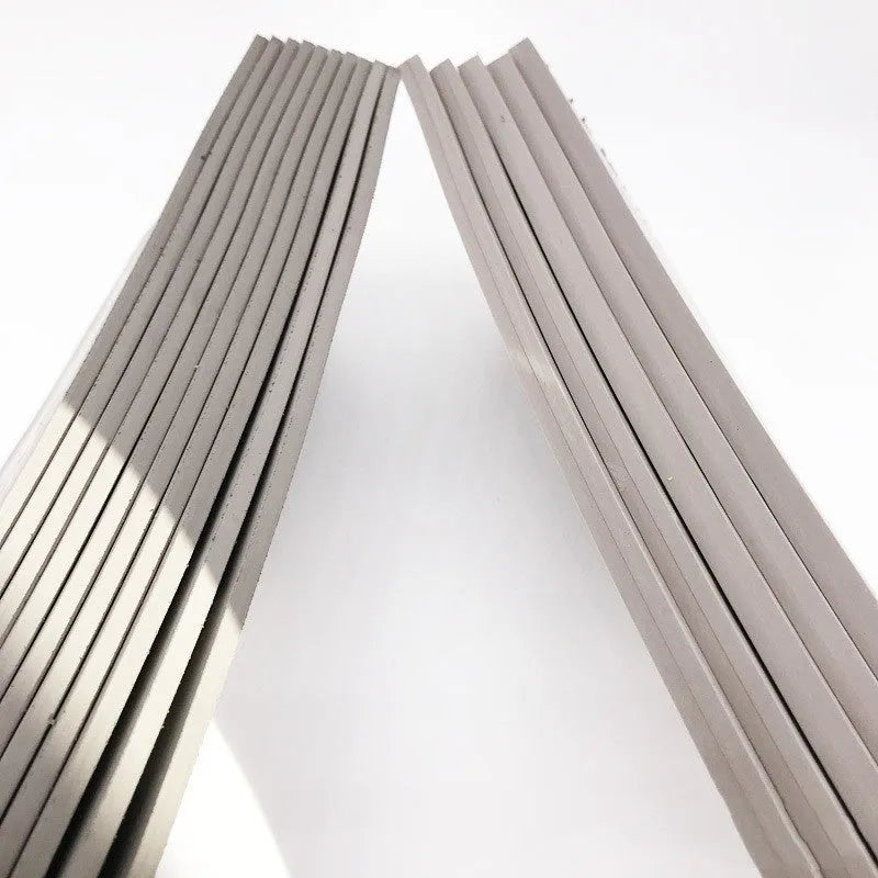 Black and grey plastic light-sensitive mat for photosensitive seals measuring 330mm by 110mm