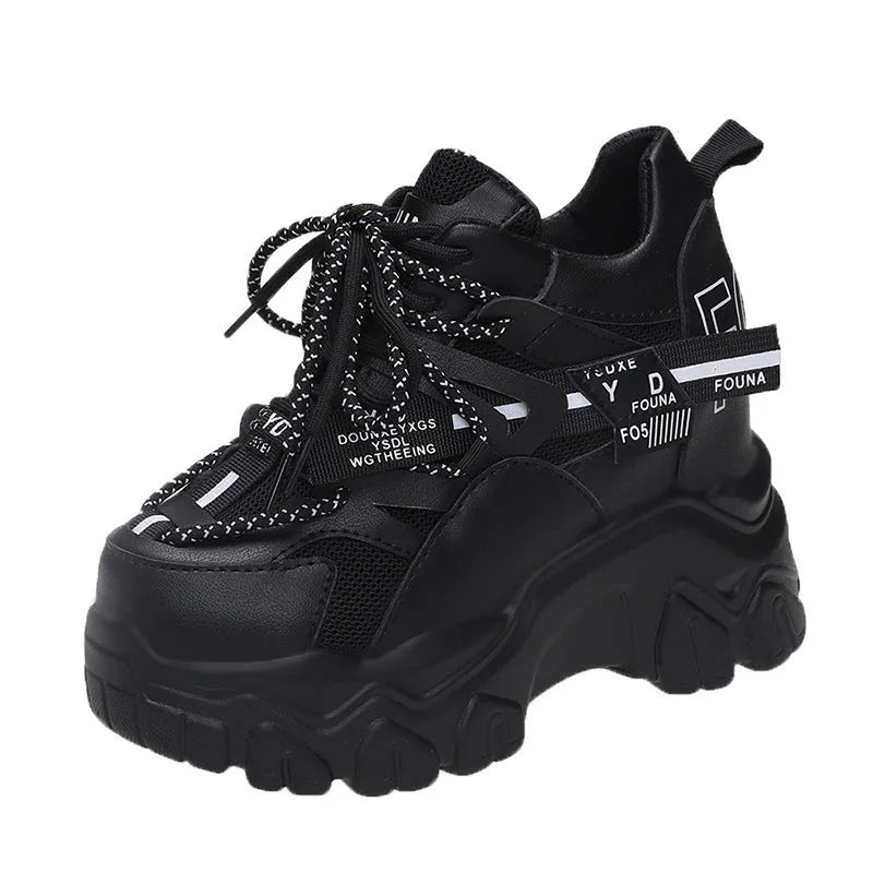Women's white and black mesh platform sports shoes with cross-strap detail and rubber soles