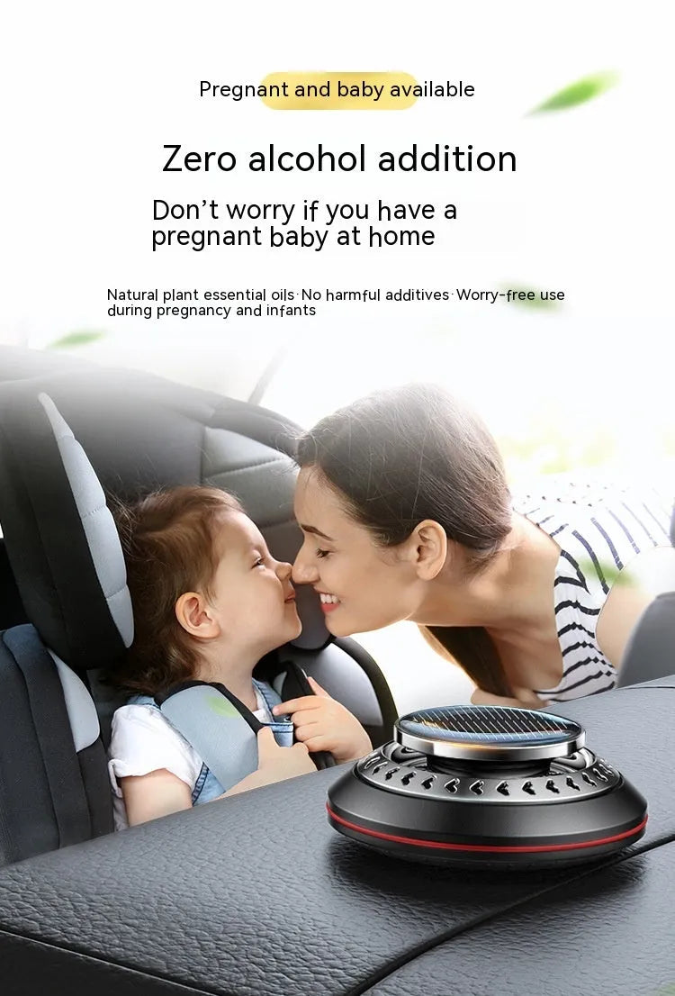 Solar-powered aluminium alloy car air freshener diffuser in black colour on a car dashboard.