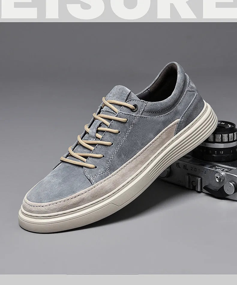 Men's grey casual skate shoes with pigskin upper and rubber sole on a white background