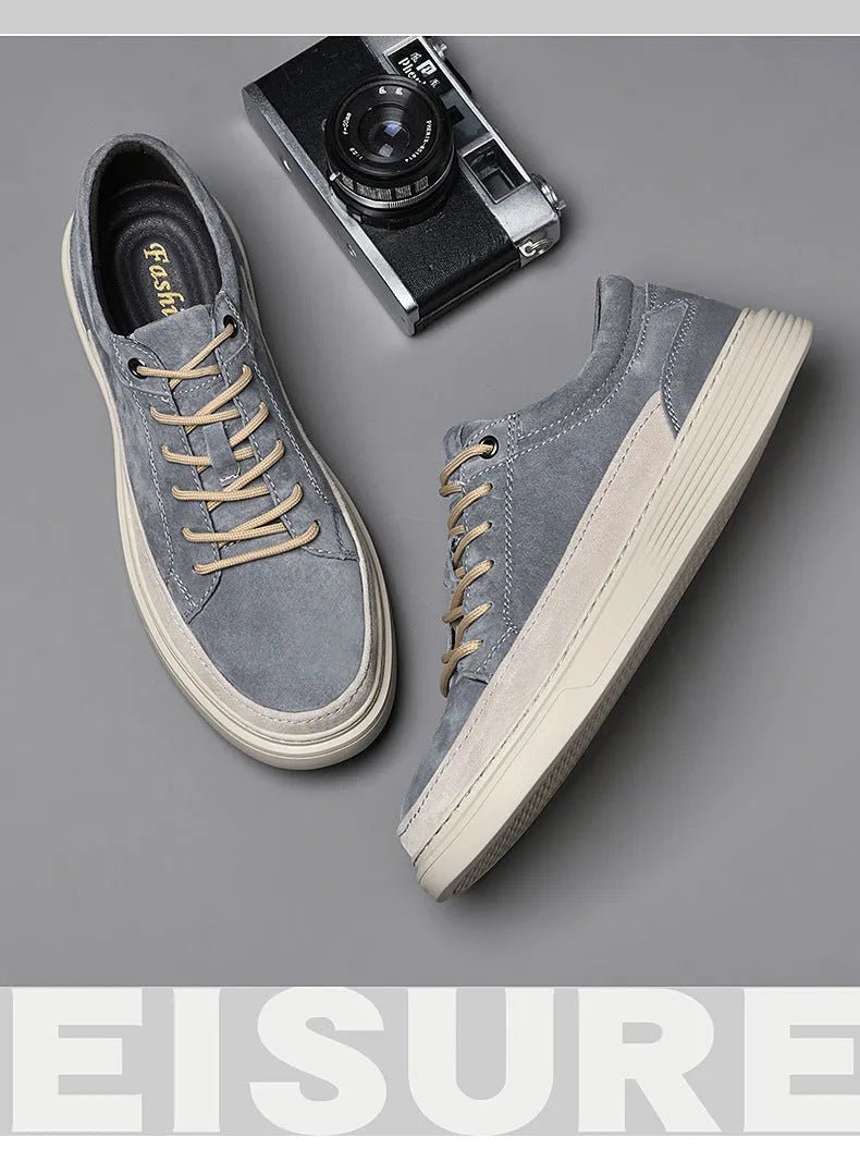Men's grey casual skate shoes with pigskin upper and rubber sole on a white background