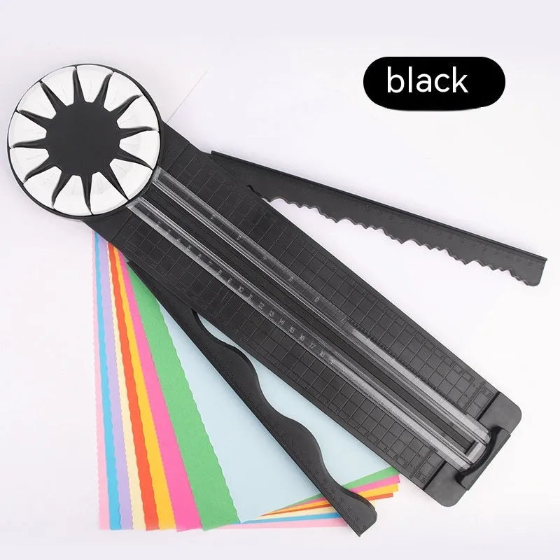 Pink 12-in-1 dotted line paper cutting machine on desktop for card making and scrapbooking