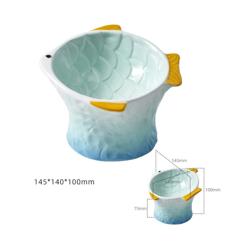 Set of four blue fish-shaped ceramic cat bowls with tilted design and elevated base