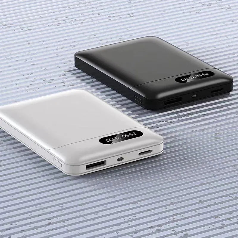 Black or white portable power bank with dual USB ports showing 10000mAh capacity label