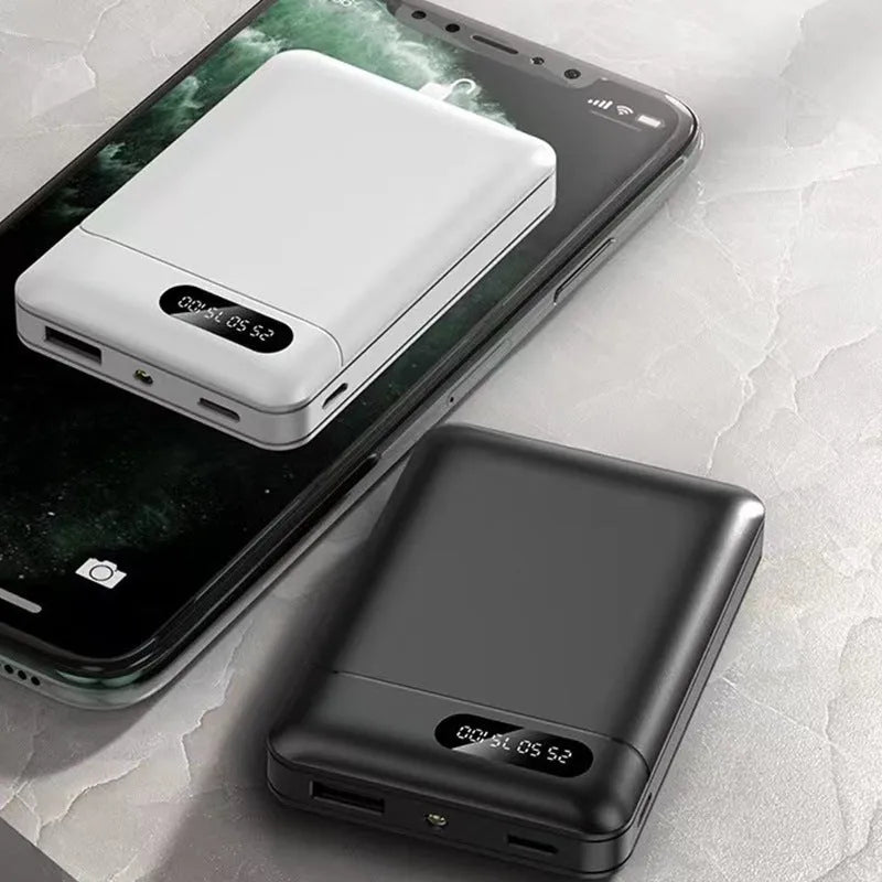 Black or white portable power bank with dual USB ports showing 10000mAh capacity label