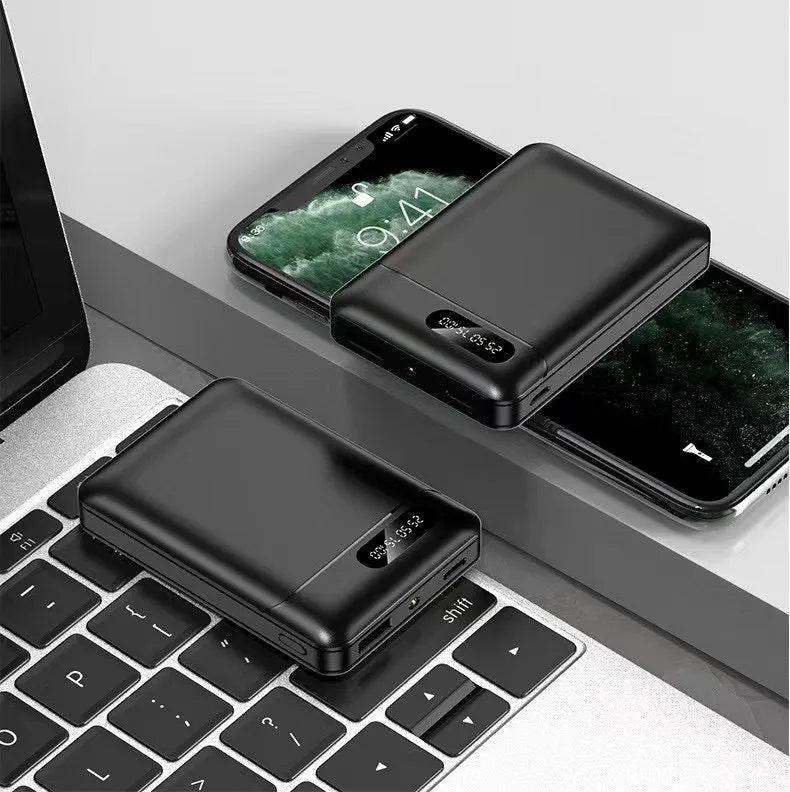 Black or white portable power bank with dual USB ports showing 10000mAh capacity label