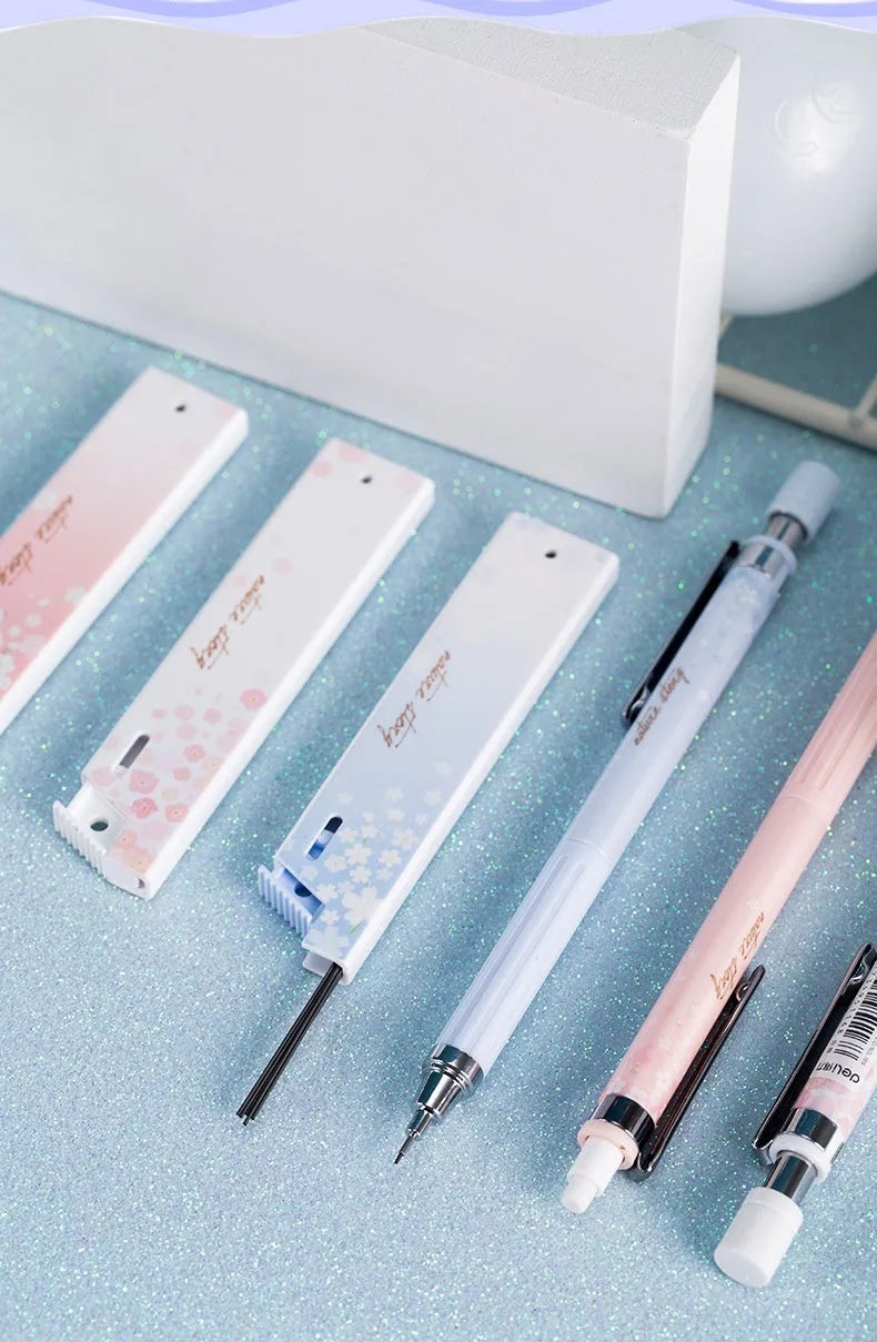 Set of three colourful cartoon-style 0.5mm automatic pencils with boxes of HB refills.
