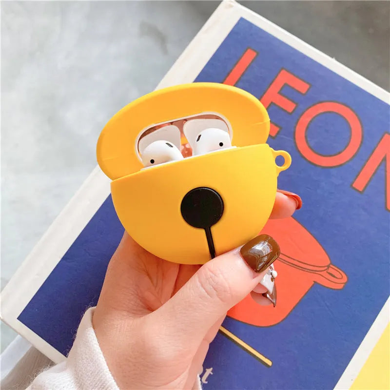 Yellow silicone AirPods case with small bell accessory attached for AirPods 1 and 2
