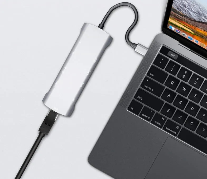 Grey aluminium USB-C docking station with HDMI, VGA, USB 3.0 ports and a 140mm cable.