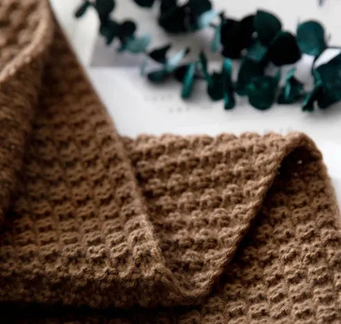 Nordic fringed knit ball acrylic blanket in beige colour showing texture detail and 130x170cm size