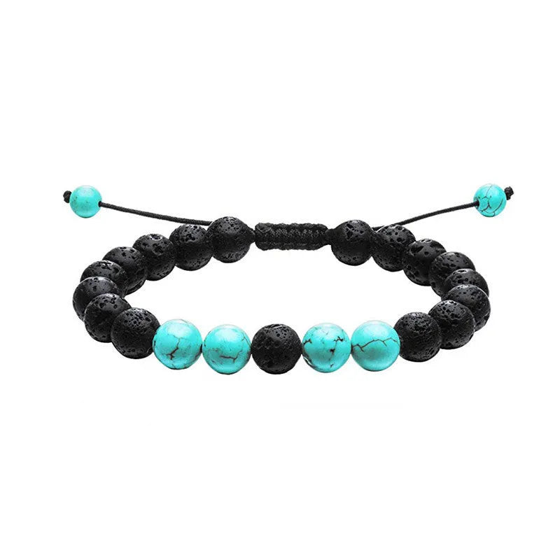 A pair of matte black agate bead bracelets with geometric design for him and her.