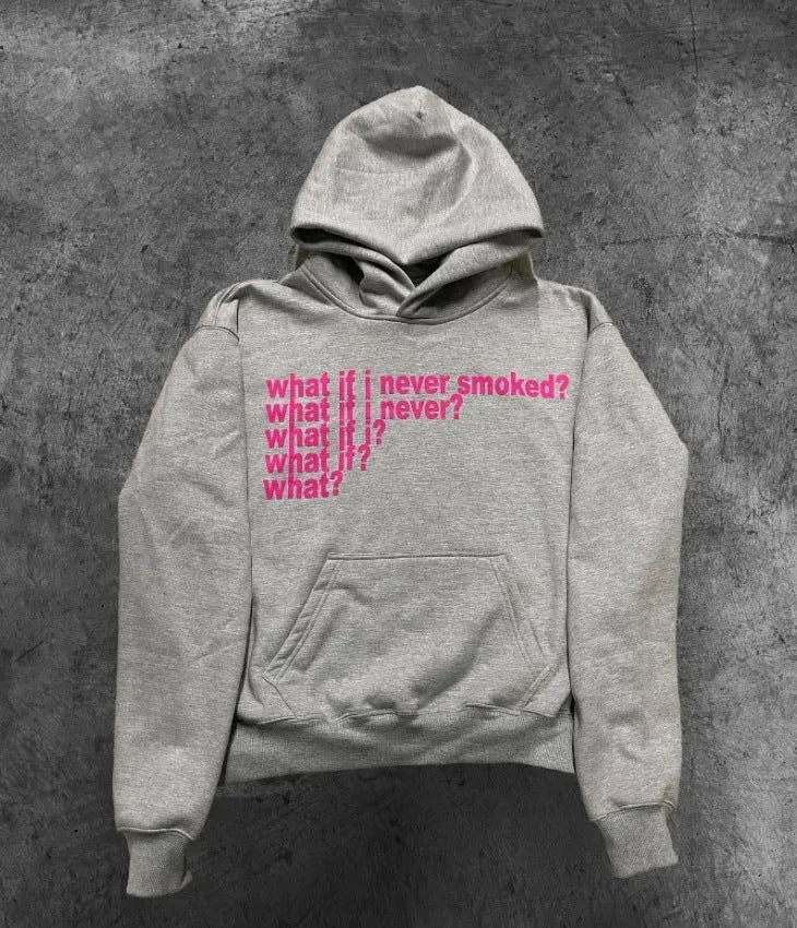 Man wearing a black heavyweight hooded sweater with a large white letter print design on the front.