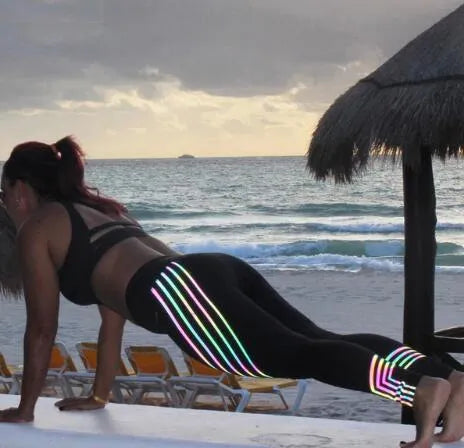 Women's black fitness leggings with glowing night print pattern, slim fit pencil pants style