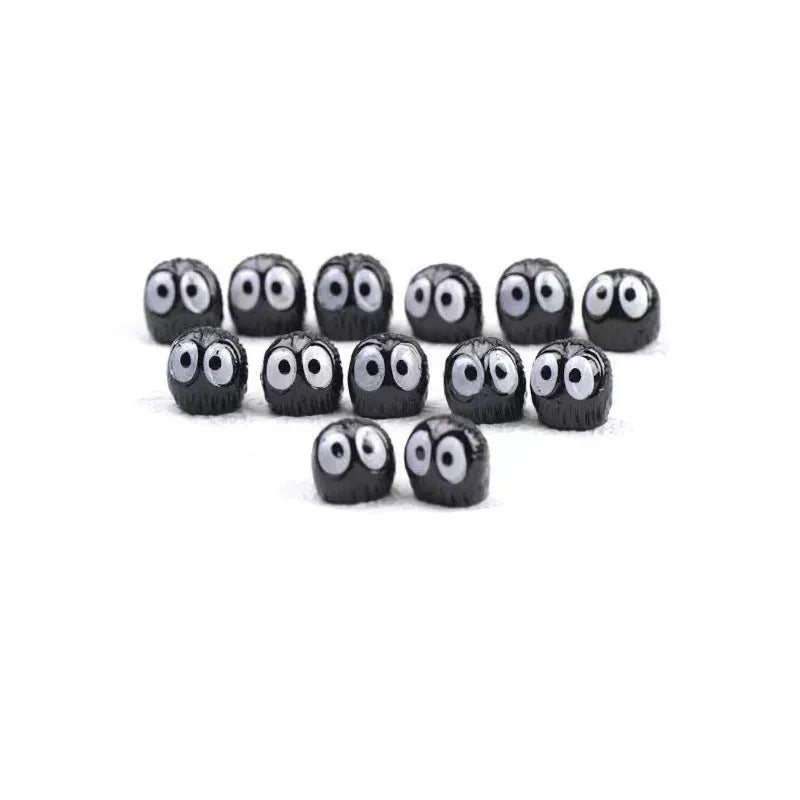 Small cartoon-style coal ball resin decoration for home interior walls and surfaces.