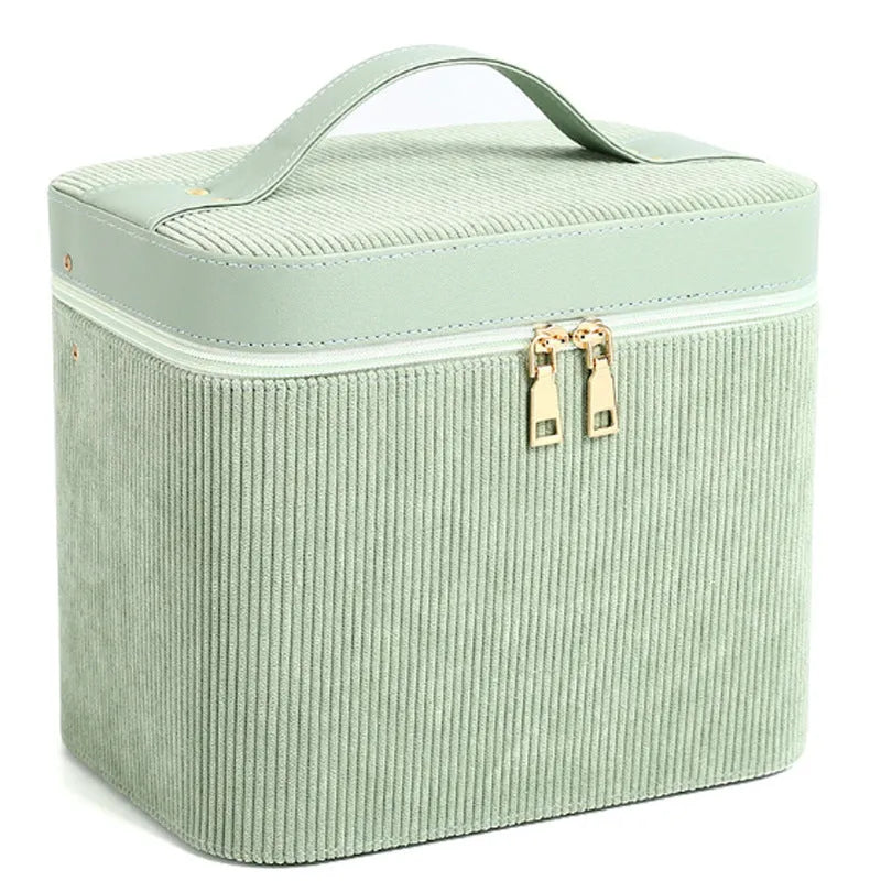 Large corduroy cosmetic storage box with solid colour exterior and polyester cotton lining.