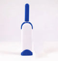 Blue reusable pet hair removal brush with self-cleaning base for sofas and upholstery.