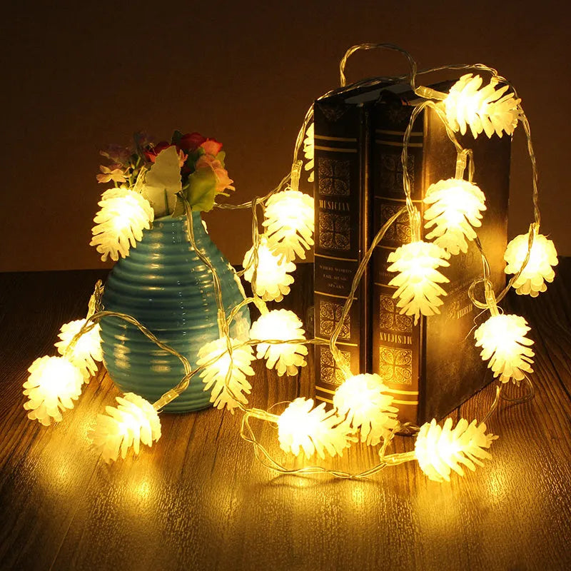 Warm white battery-powered LED pine cone decorative string lights shown in a 10-light or 20-light option.
