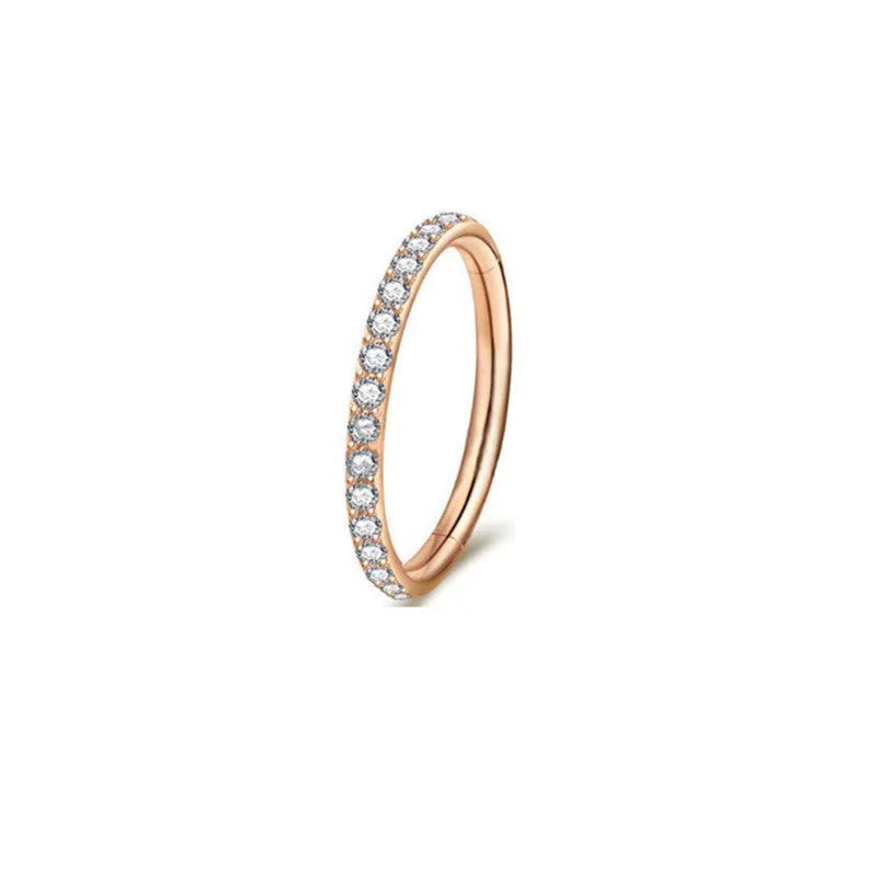 A round stainless steel seamless nose ring shown in gold, rose gold, black, and steel colour finishes.