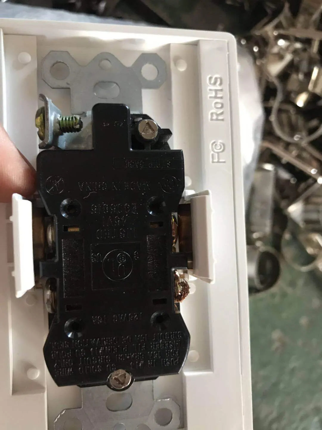 White socket induction LED night light plugged into wall outlet with automatic sensor